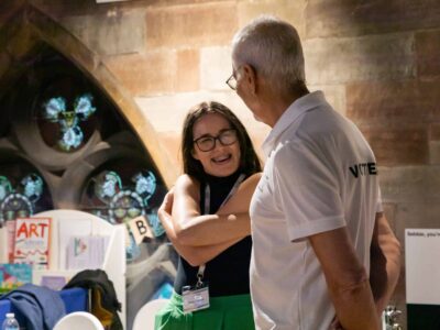 Volunteering at Lichfield Festival A Festival staff member in joyful conversation with a Festival volunteer.