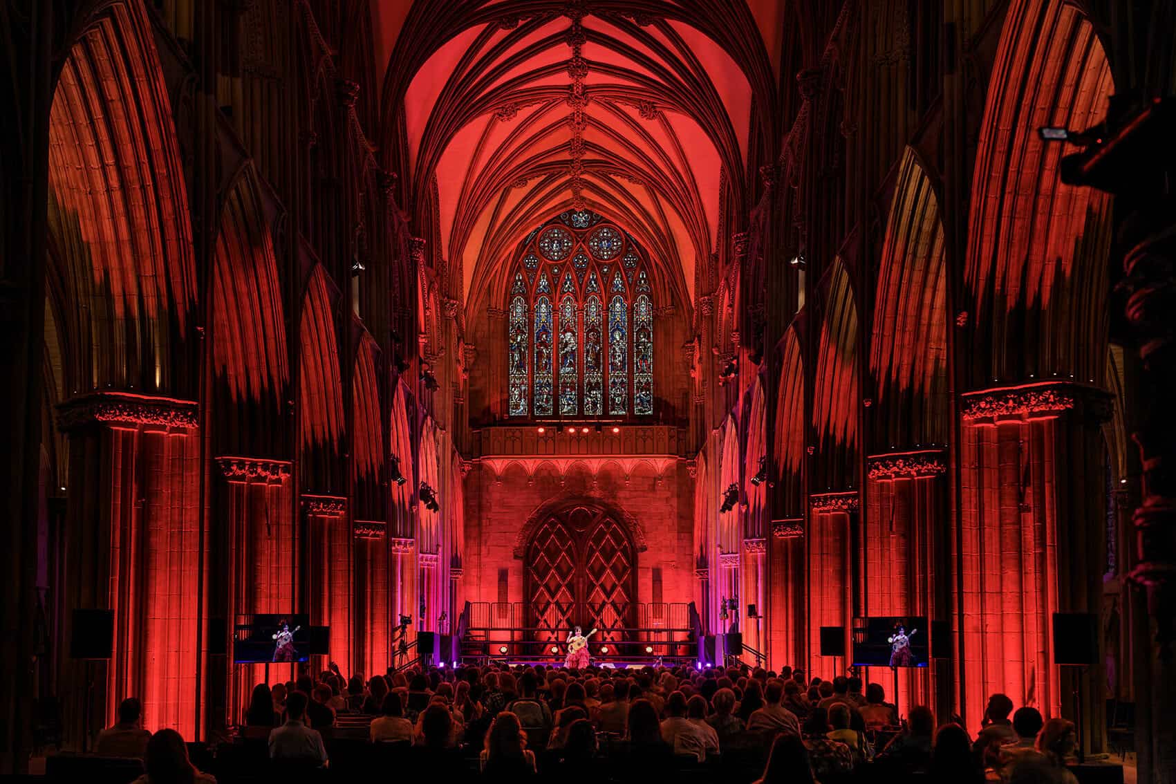 Lichfield Cathedral lit in red