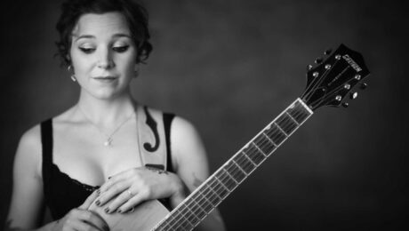 Holly Carter poses with a guitar