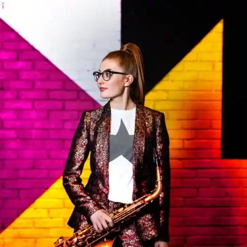 Jess Gillam with saxophone.