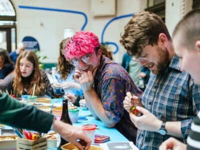 Alex Clark-Michalek Alex Clark-Michalek smiles amidst an art workshop.