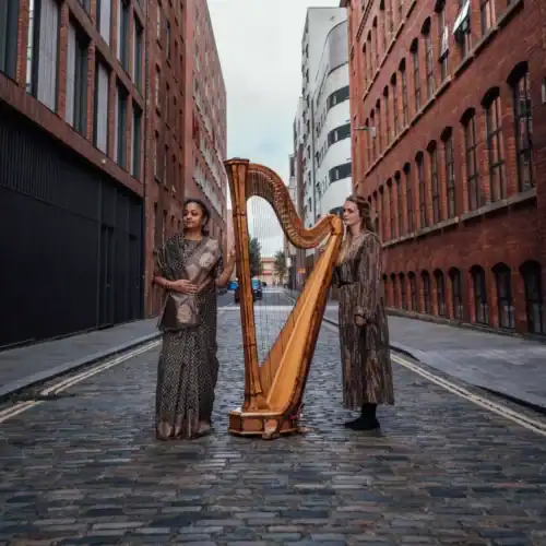 Supriya Nagarajan and Lucy Nolan with harp.
