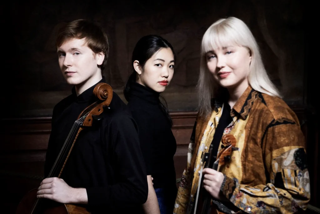 Headshots of the Paddington Trio musicians.