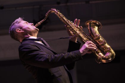 Tommy Smith plays Saxophone on stage