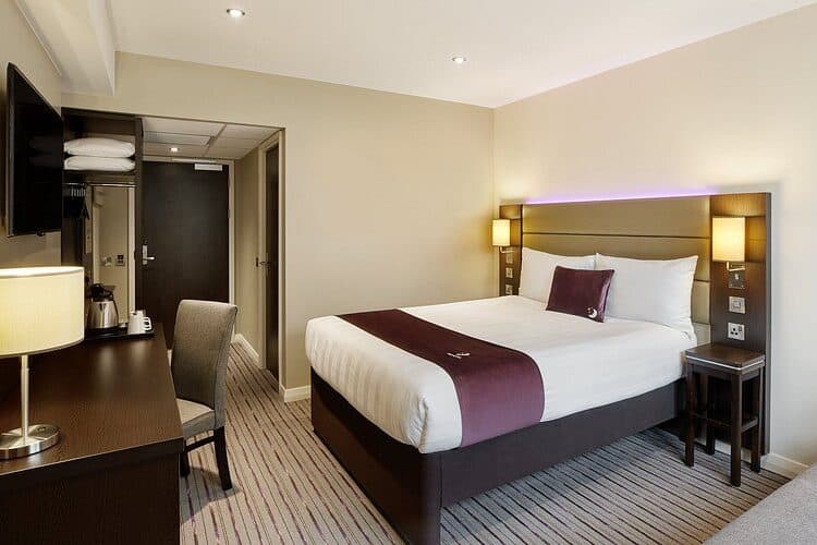 A bed in a modern looking hotel room